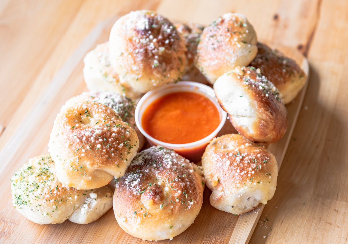 Order Garlic Knots - 6 Pieces food online from Italy's Restaurant & Pizzeria store, Phillipsburg on bringmethat.com