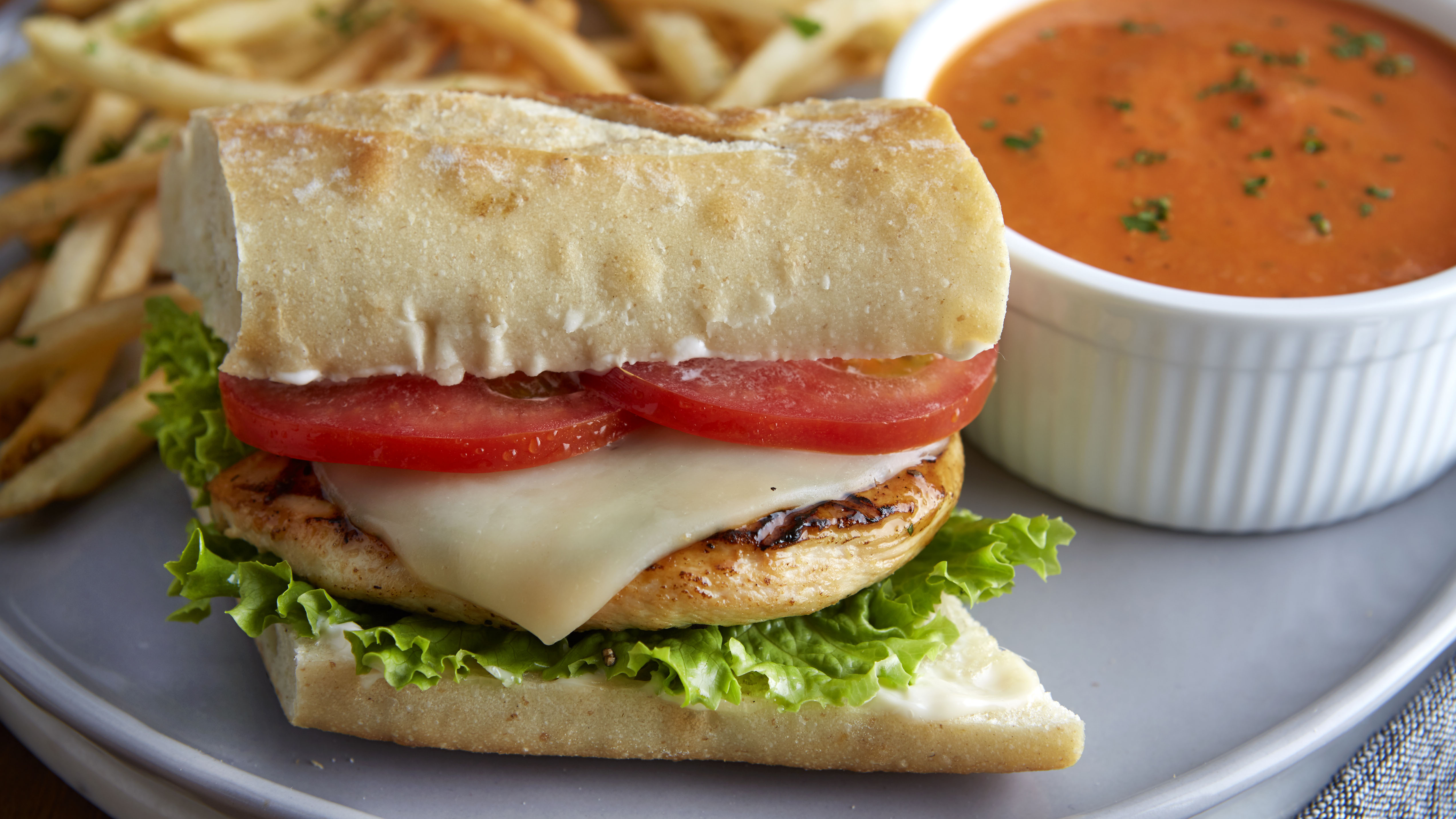 Order Grilled Chicken Baguette food online from Mimi's Cafe store, Victorville on bringmethat.com