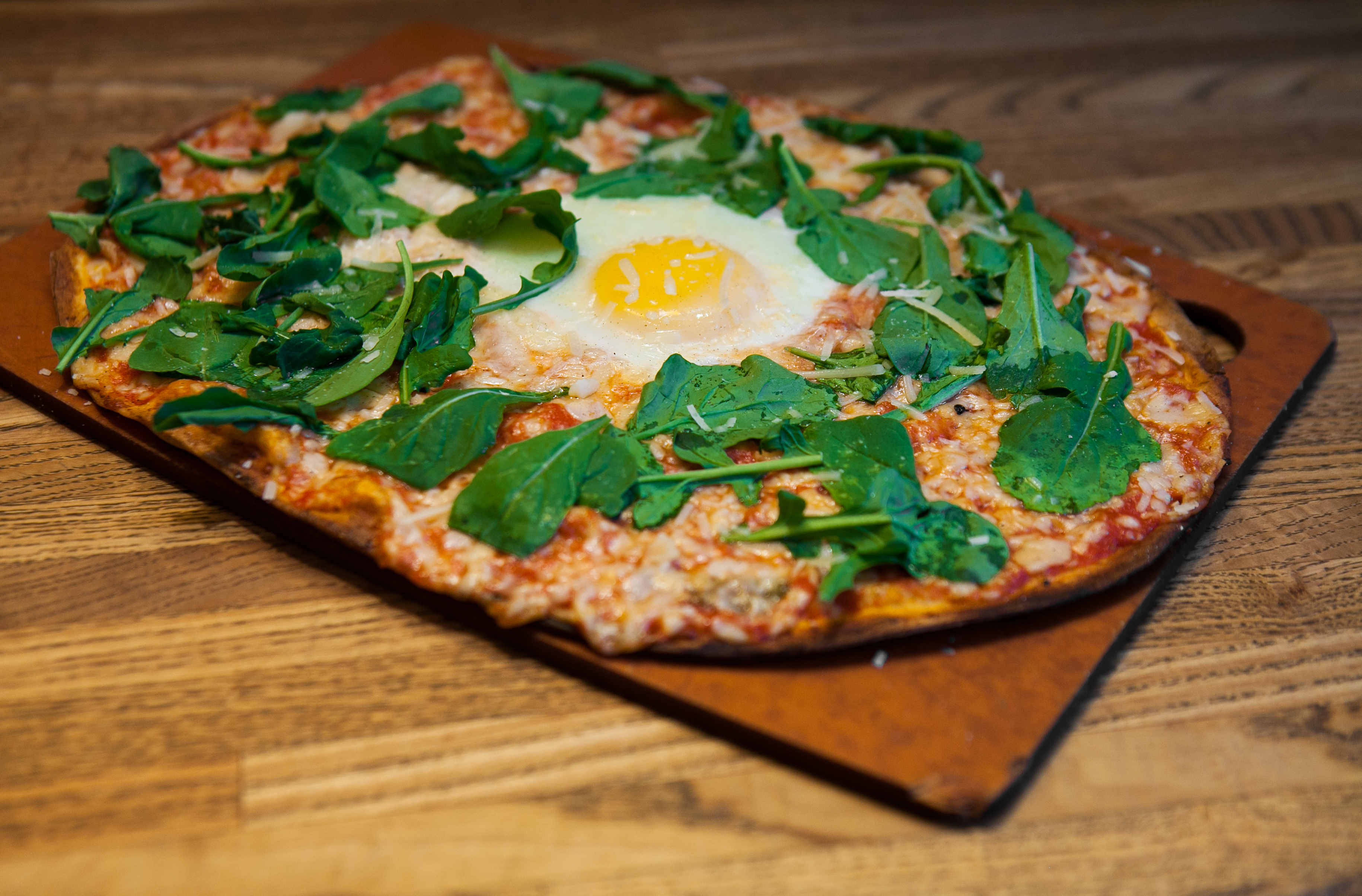 Order Arugula, Garlic and Sunny Side Eggs Pizza food online from Waldy's wood fired pizza store, New York on bringmethat.com