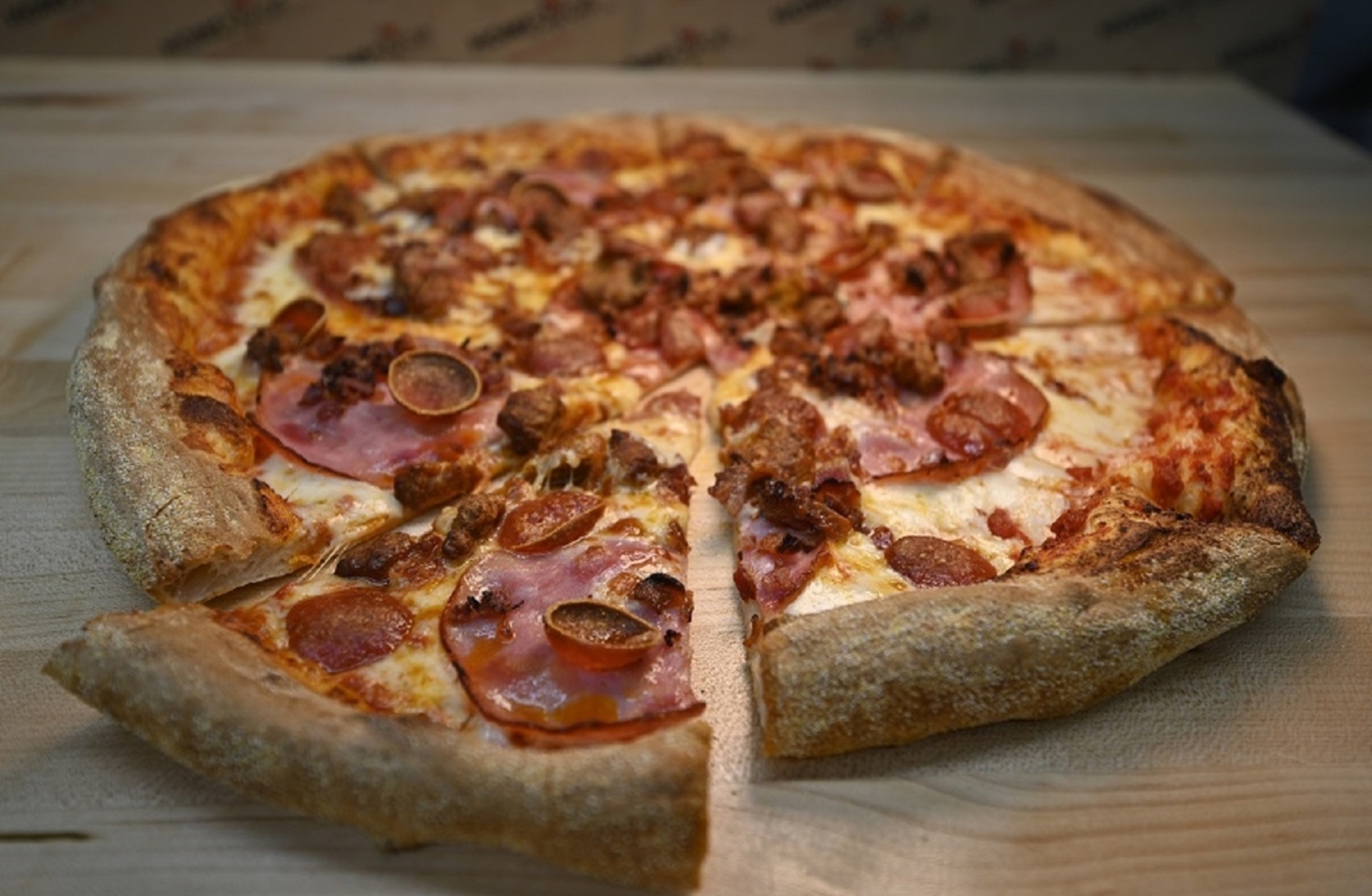 Order 16" Strongman Meat Pizza food online from Homeslyce Columbia store, Columbia on bringmethat.com