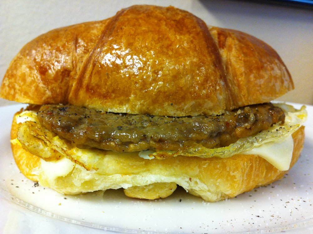 Order Sausage, Egg and Cheese Croissant food online from Malenee Donuts store, La Porte on bringmethat.com