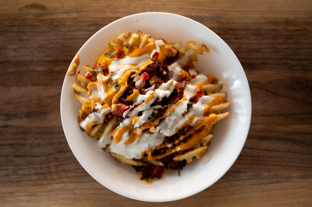 Order Loaded Waffle Fries food online from Southern Cross Kitchen store, Conshohocken on bringmethat.com