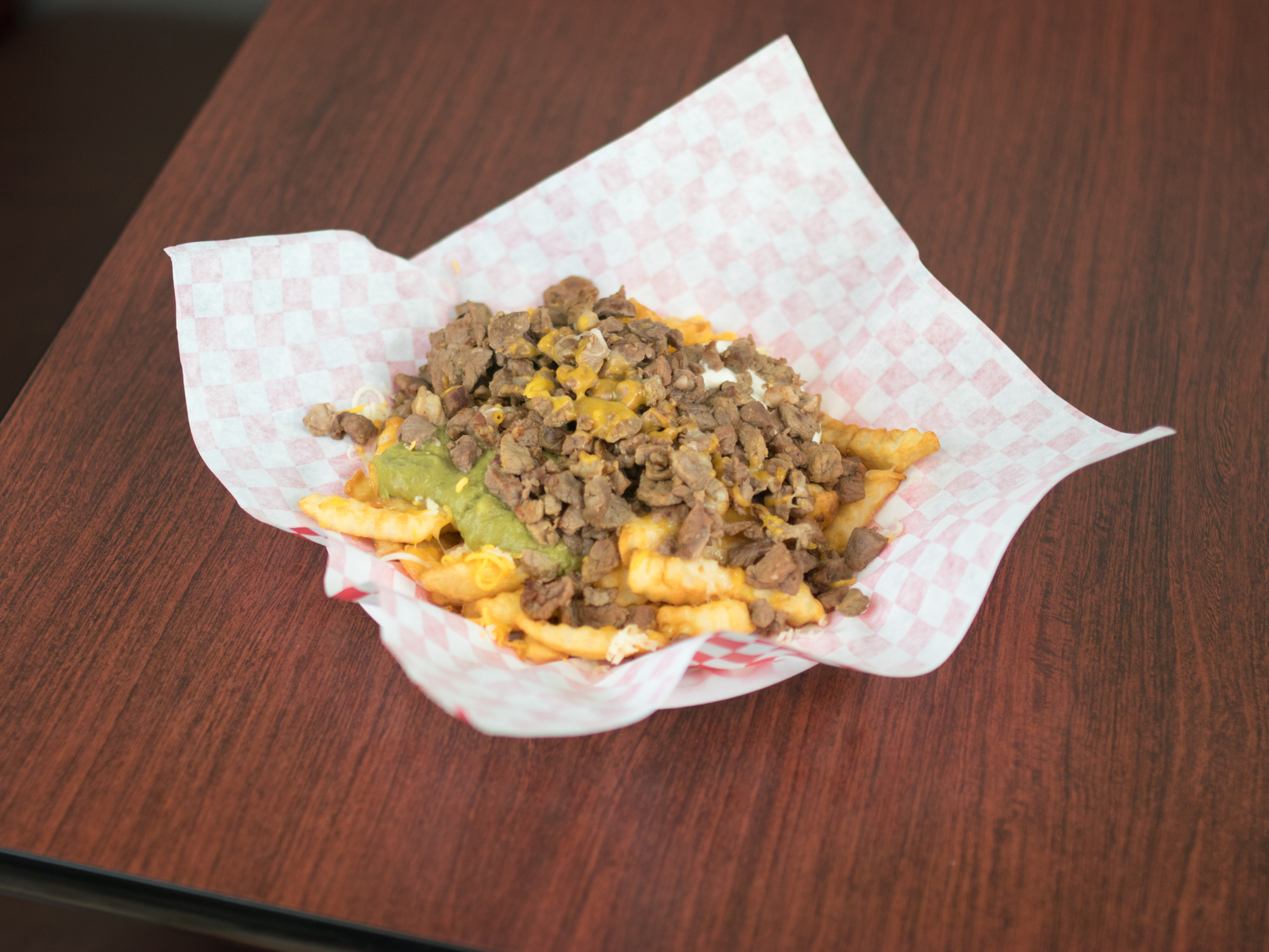 Order Carne Asada Fries food online from Linas Mexican Restaurant store, Omaha on bringmethat.com