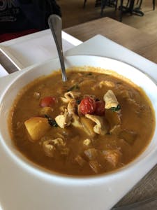 Order Mango Red Curry food online from Golden Triangle Cuisine store, Los Gatos on bringmethat.com