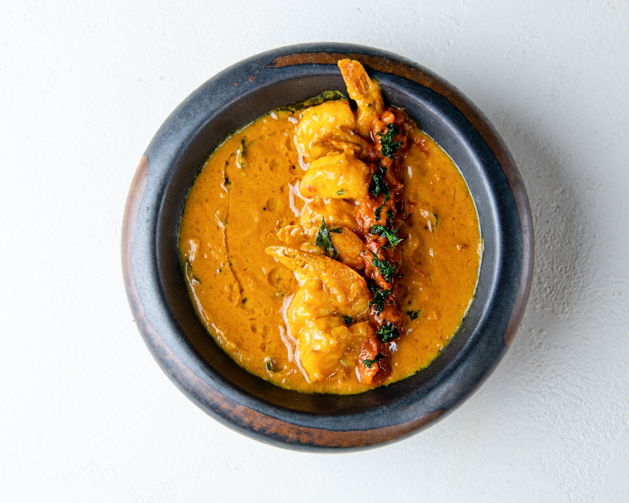 Order Prawn Mango Curry (GF) food online from Southern Spice store, Irvine on bringmethat.com