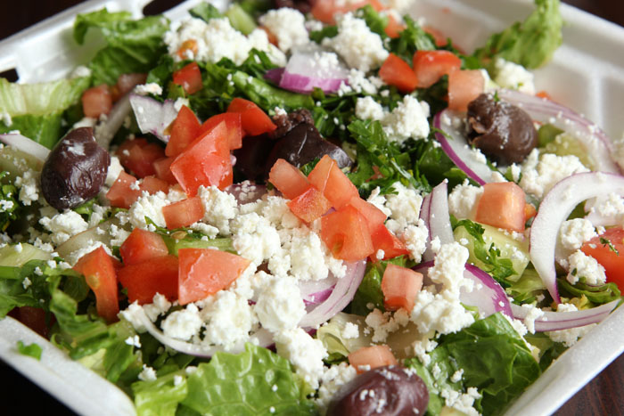 Order Greek Salad food online from Myrna's Kitchen store, Stamford on bringmethat.com
