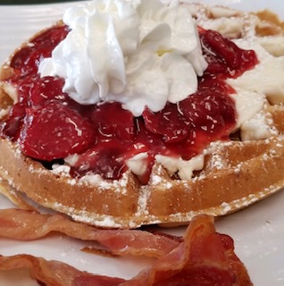 Order Strawberries and Cream Cheese Icing Waffle food online from Sweet Buzz Bean & Bistro store, Harrison City on bringmethat.com