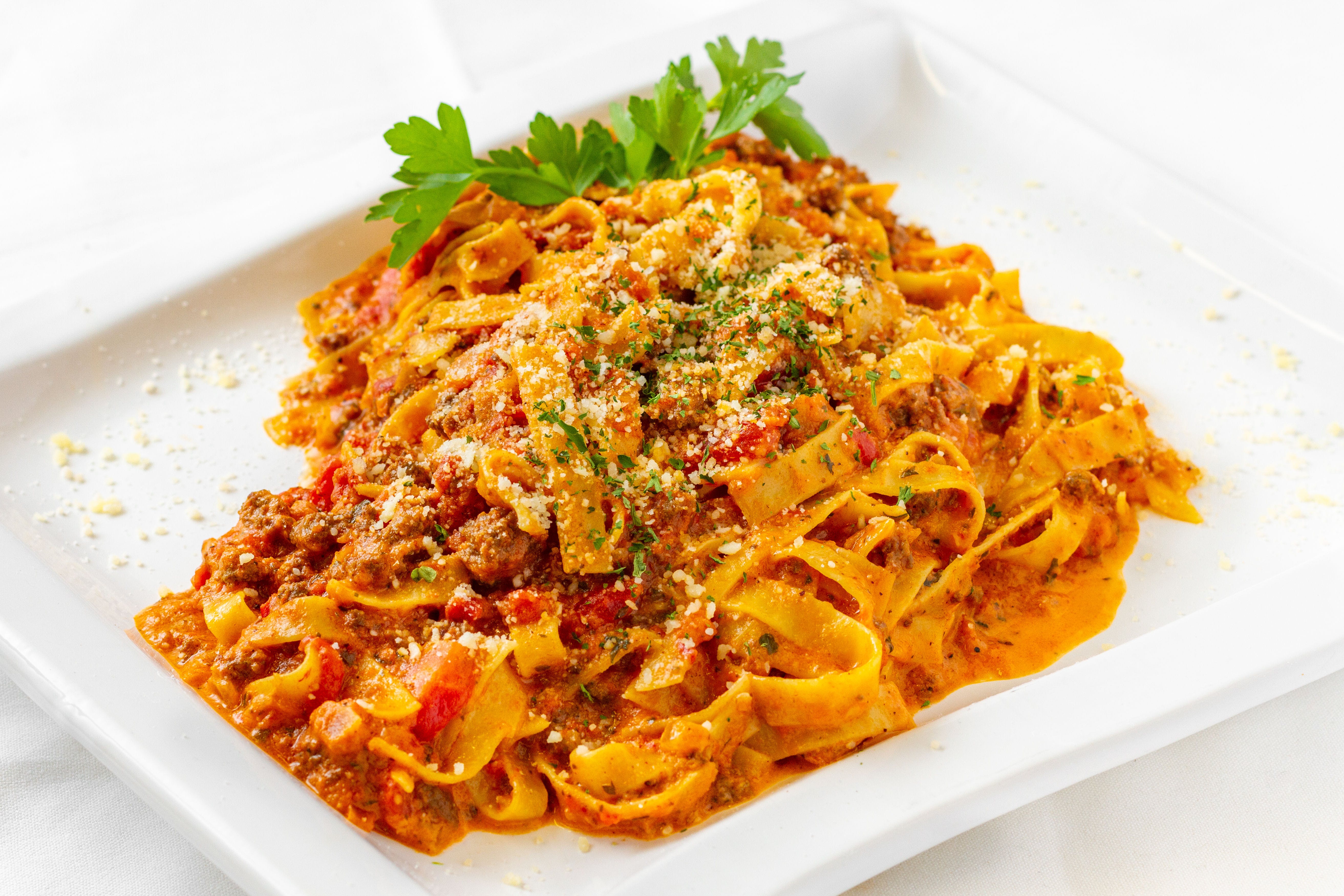 Order Fettuccine Bolognese - Pasta food online from Milano's Pizza - Gaithersburg store, Gaithersburg on bringmethat.com
