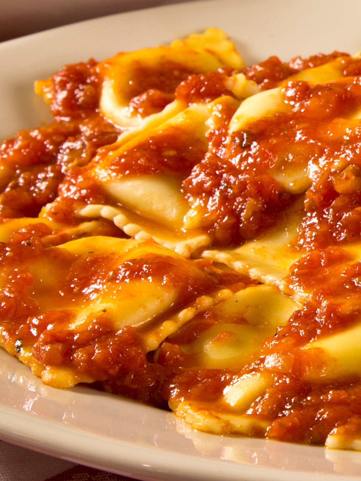 Order Ravioli Al Pomodoro - Small (Serves 3 People) food online from Buca Di Beppo store, Midvale on bringmethat.com