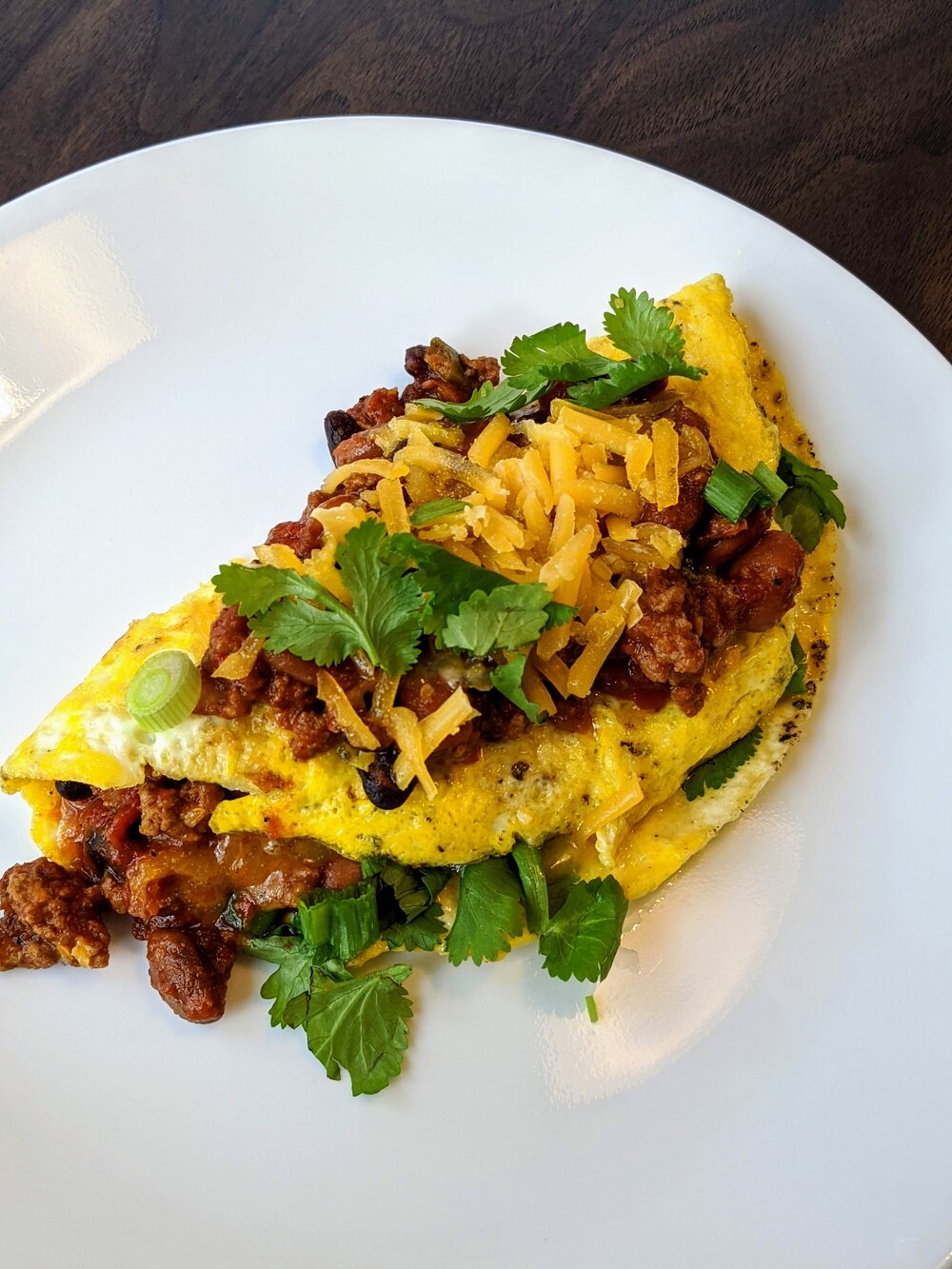 Order Chili & Cheddar Omelette. food online from Jackson Hole store, Englewood on bringmethat.com