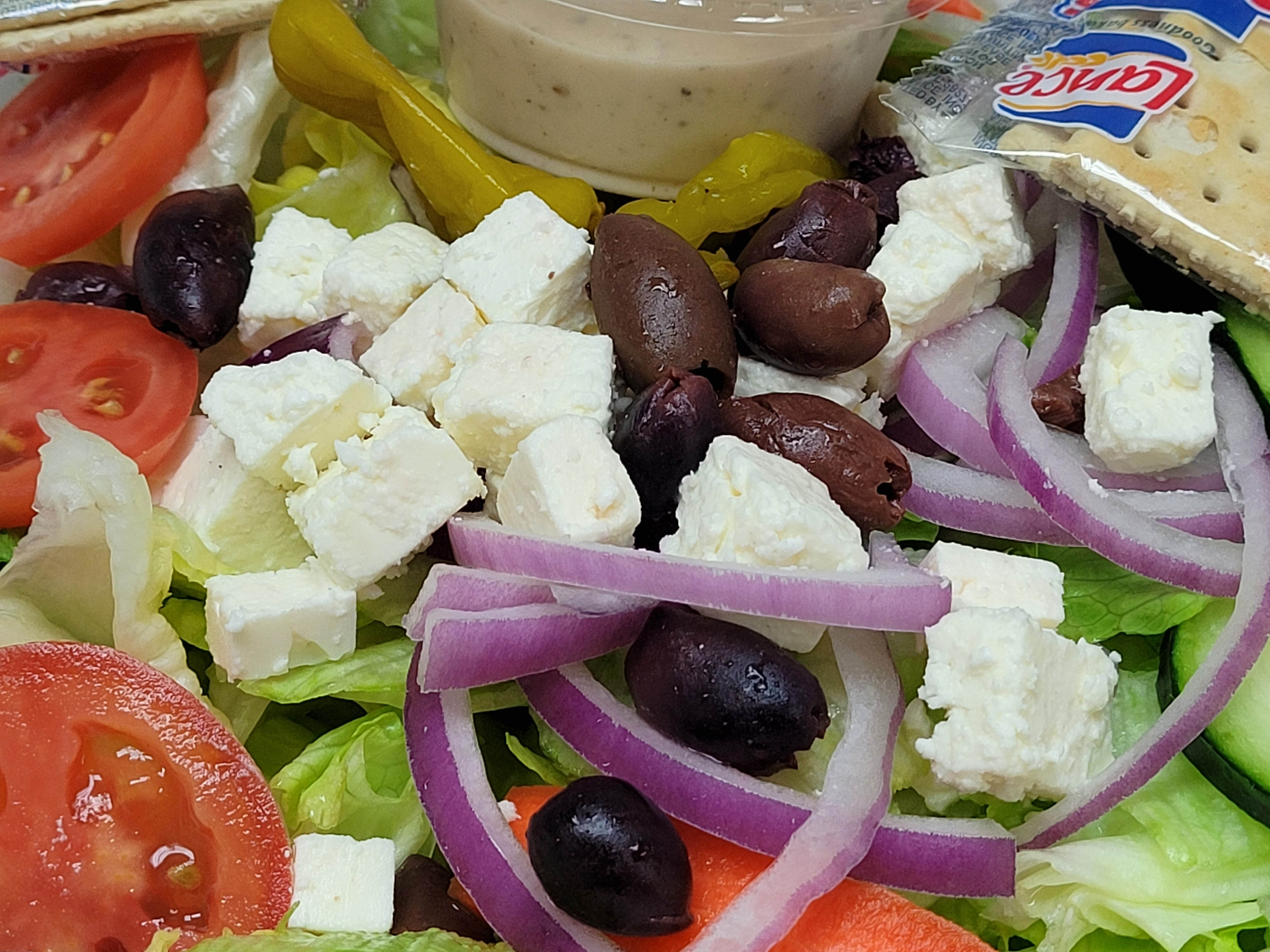Order Greek Salad food online from Illianos Pizza store, Clemmons on bringmethat.com