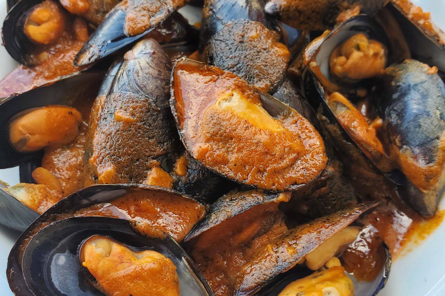 Order Black Mussels 0.5 lb food online from Hook & Reel Cajun Seafood store, West Valley City on bringmethat.com