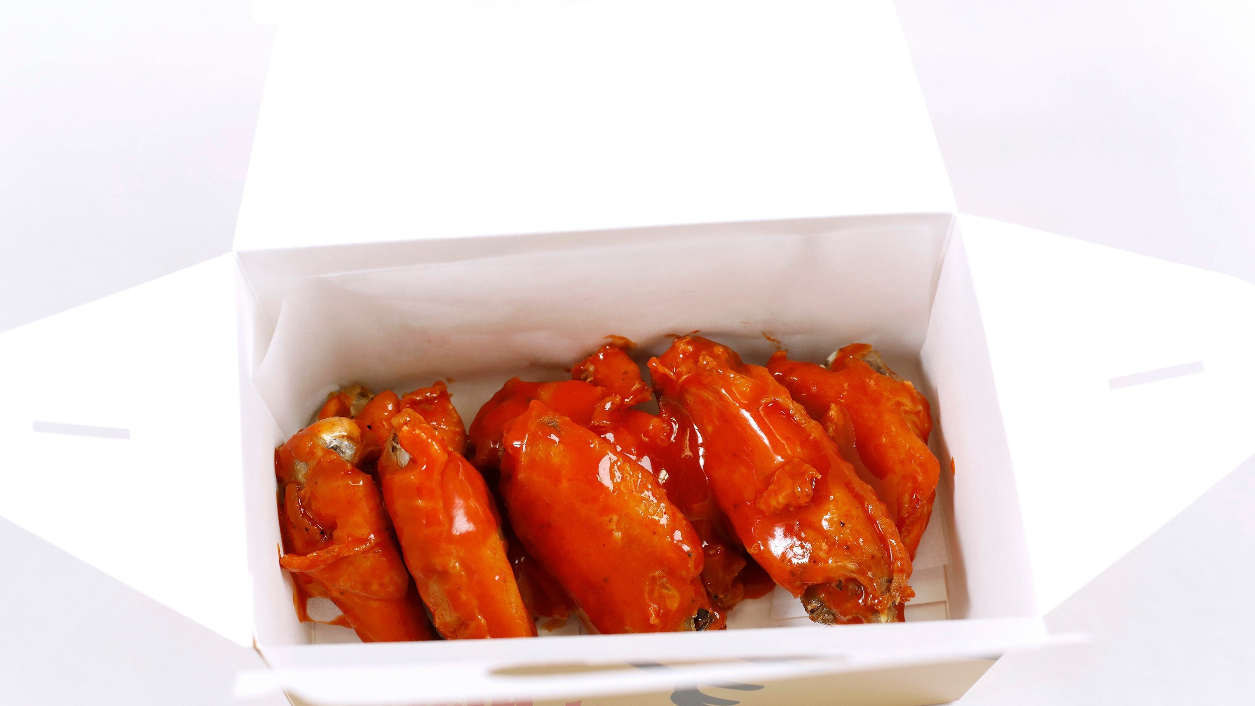 Order Sriracha Buffalo Wings (8) food online from Holy Cluck store, Chicago on bringmethat.com