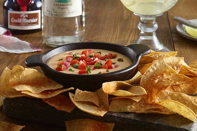 Order Cheddar Cheese Queso & Chips food online from Ruby Tuesdays store, Waycross on bringmethat.com