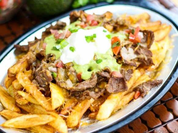 Order Asada Fries food online from Matachines Authentic Mexican Food store, Edmond on bringmethat.com