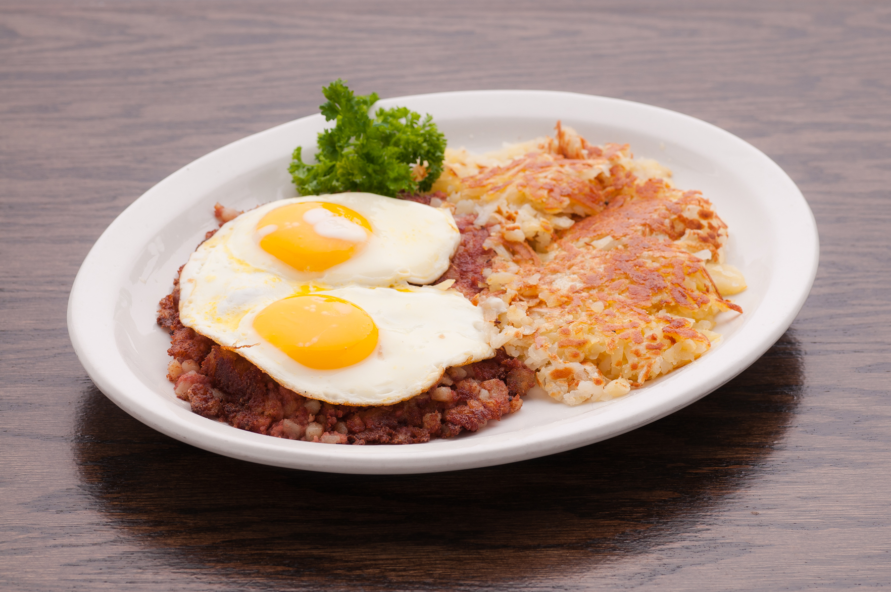 Order 2 Eggs Any Style with Corn Beef Hash food online from Rice n' bread store, Chicago on bringmethat.com