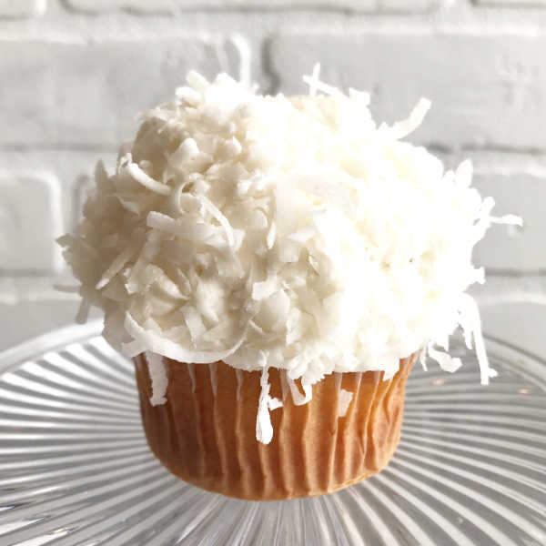 Order Coconut Cupcake food online from Sugar Blossom Bake Shop store, San Clemente on bringmethat.com