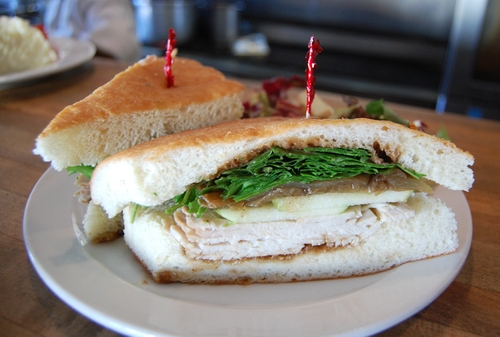 Order Turkey, Apple & Arugula Sandwich food online from Rosti Tuscan Kitchen store, Santa Monica on bringmethat.com