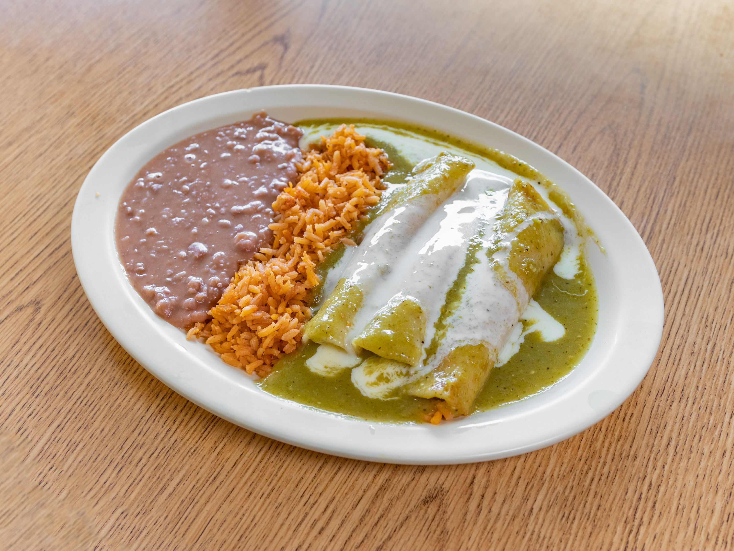 Order Enchiladas Suizas Dinner food online from Taqueria Los Compadres store, Omaha on bringmethat.com
