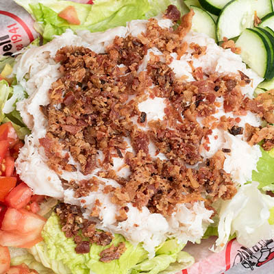 Order *Turkey & Bacon Salad food online from Groucho's Deli store, Spartanburg on bringmethat.com