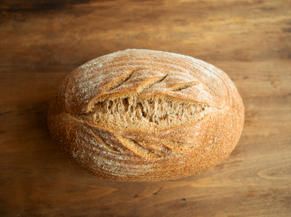 Order Hearty Wheat 1.5 lb food online from Wealthy Street Bakery store, Grand Rapids on bringmethat.com