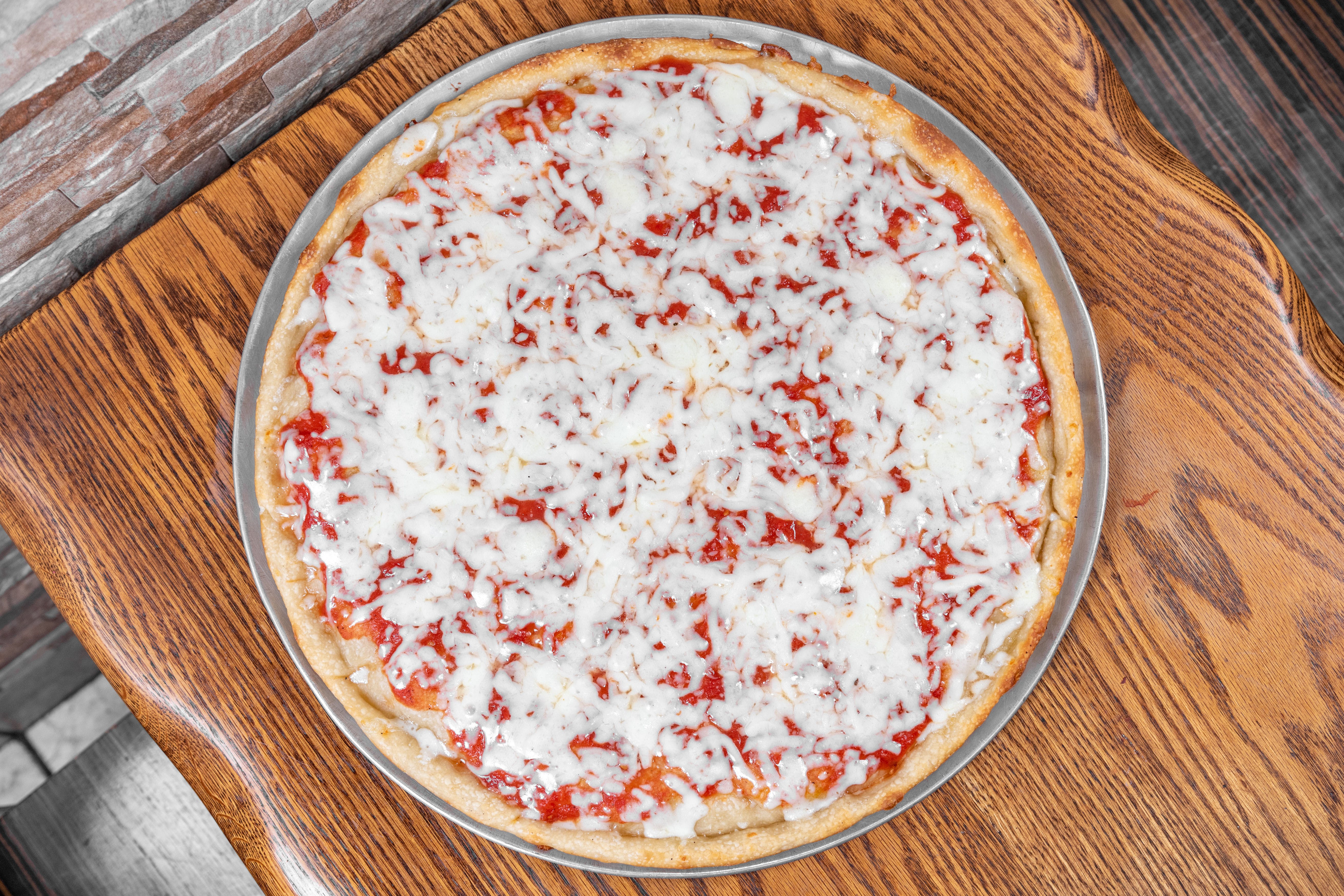 Order Cheese Pizza - Small food online from La Casa Mia Pizzeria & Restaurante store, Brooklyn on bringmethat.com