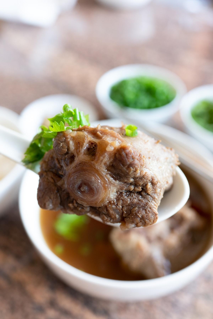 Order PHO OXTAIL food online from District One Kitchen & Bar store, Las Vegas on bringmethat.com