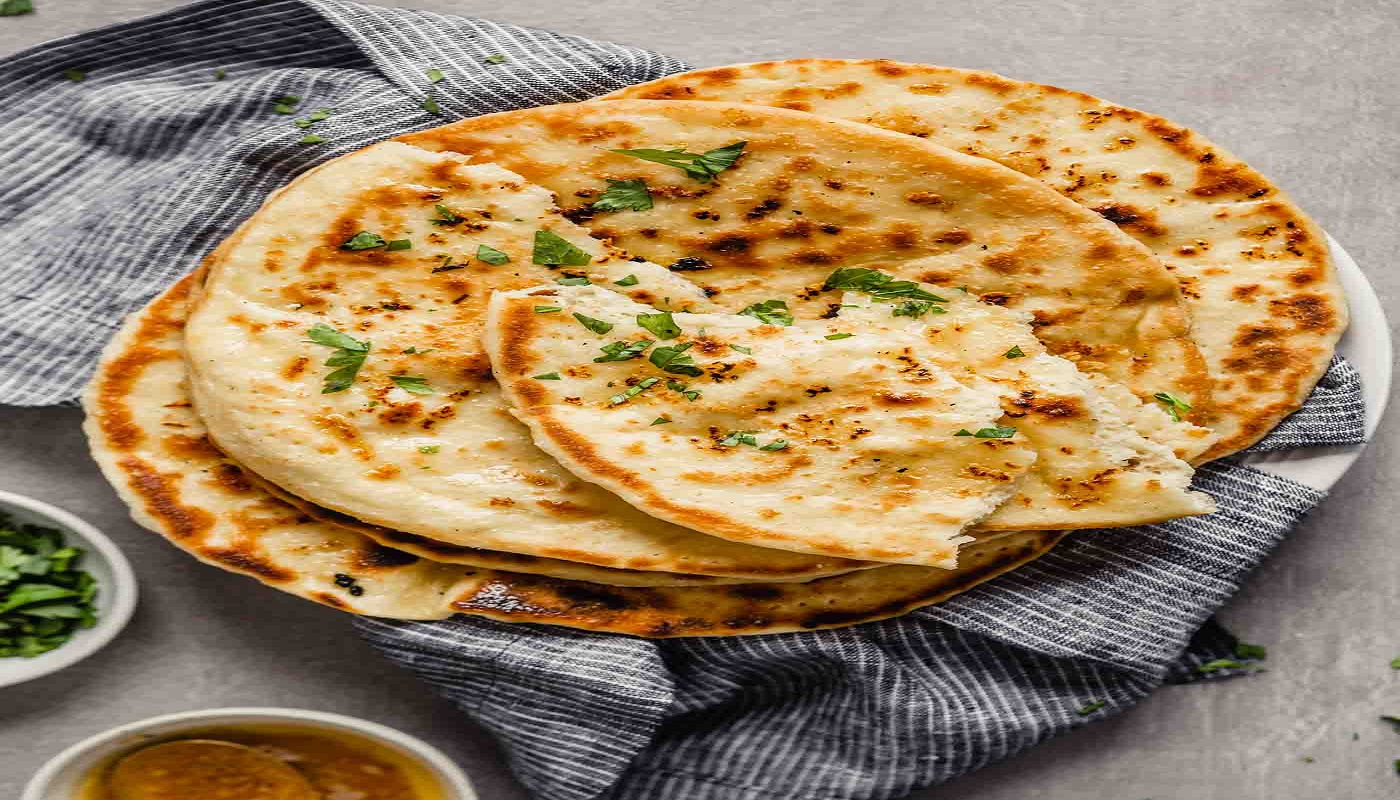 Order Garlic Naan food online from Aroma Indian Cuisine store, Ann Arbor on bringmethat.com