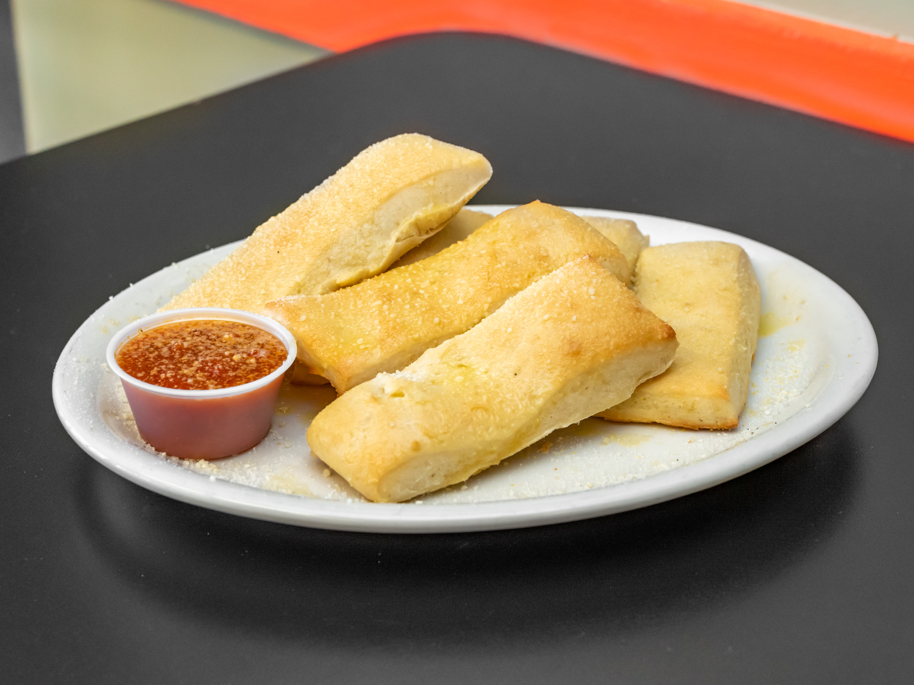 Order 6 Garlic Breadsticks food online from Tonti's Pizzeria store, Parker on bringmethat.com