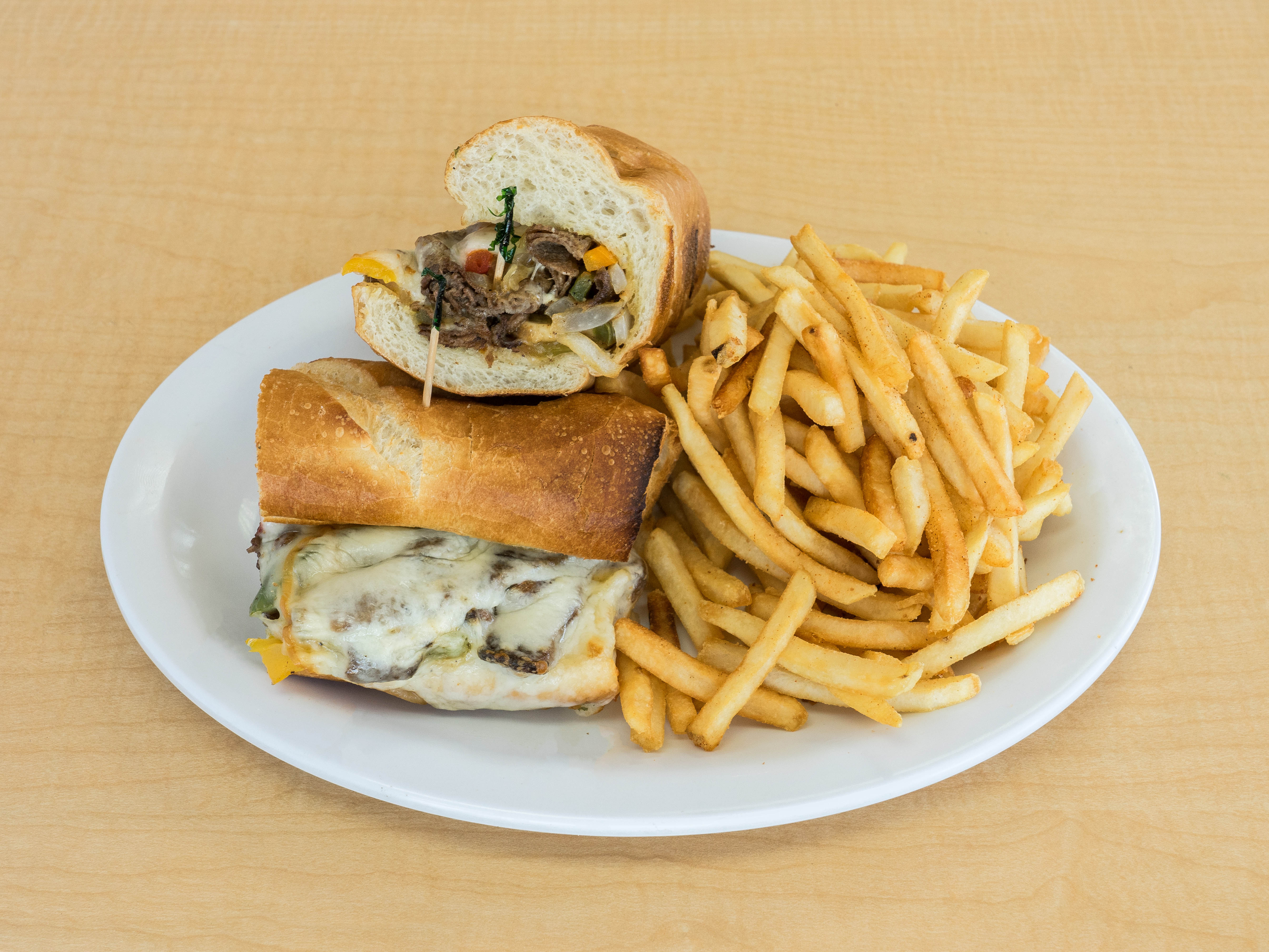 Order Philly Cheese Steak Sandwich With Fries food online from The Hideout Pizza & Grill store, Anaheim on bringmethat.com