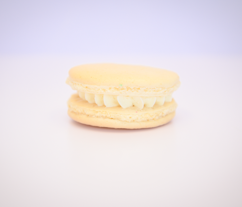 Order Vanilla Bean Macaron food online from Pietro's Bakery & Cafe store, Frisco on bringmethat.com