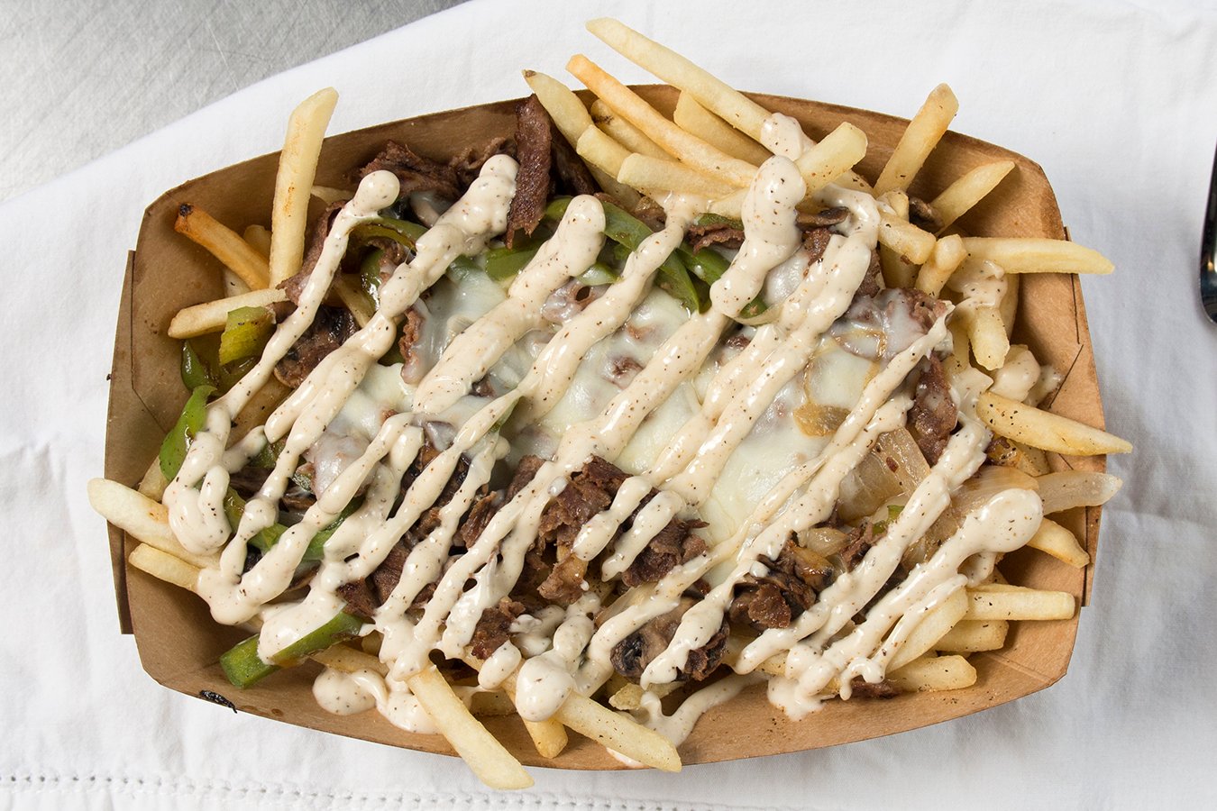 Order PHILLY CHEESESTEAK FRIES food online from Burros & Fries store, National City on bringmethat.com