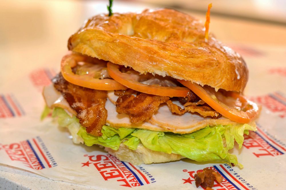 Order Turkey Club with Bacon on Croissant food online from Lee's Sandwiches store, Chino on bringmethat.com