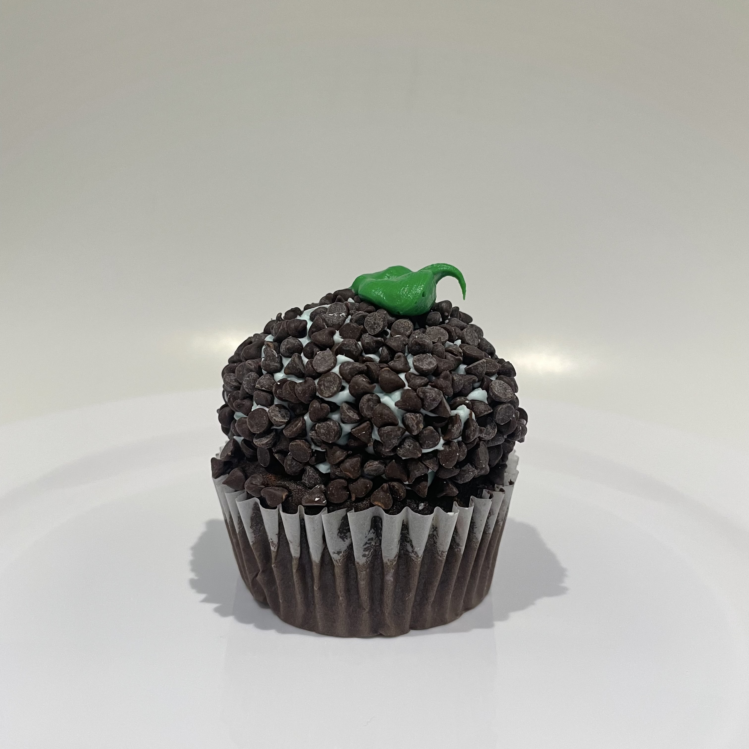 Order Mint Chocolate Chip Cupcake food online from The House of Cupcakes store, Princeton on bringmethat.com