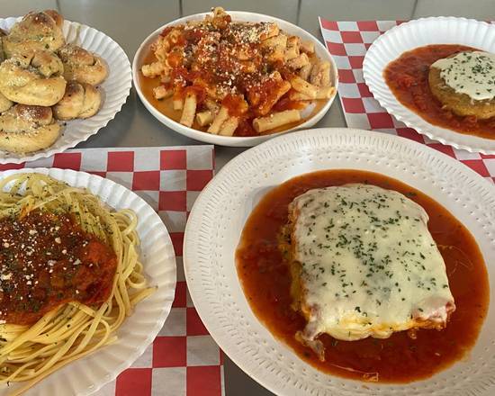 Order Tour of Italy: Large Ziti, Large Spaghetti, Slice Beef Lasagna, Chicken Parm. Patty  & 12 Knots food online from Italian Village Pizza store, Lansing on bringmethat.com