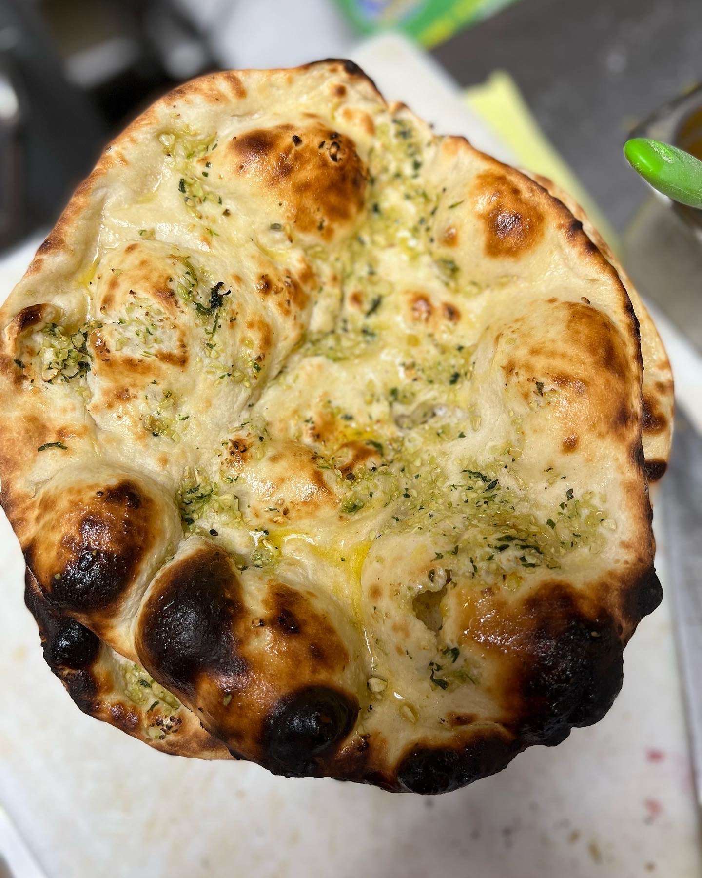 Order Garlic Naan food online from Best of India store, Nashville on bringmethat.com