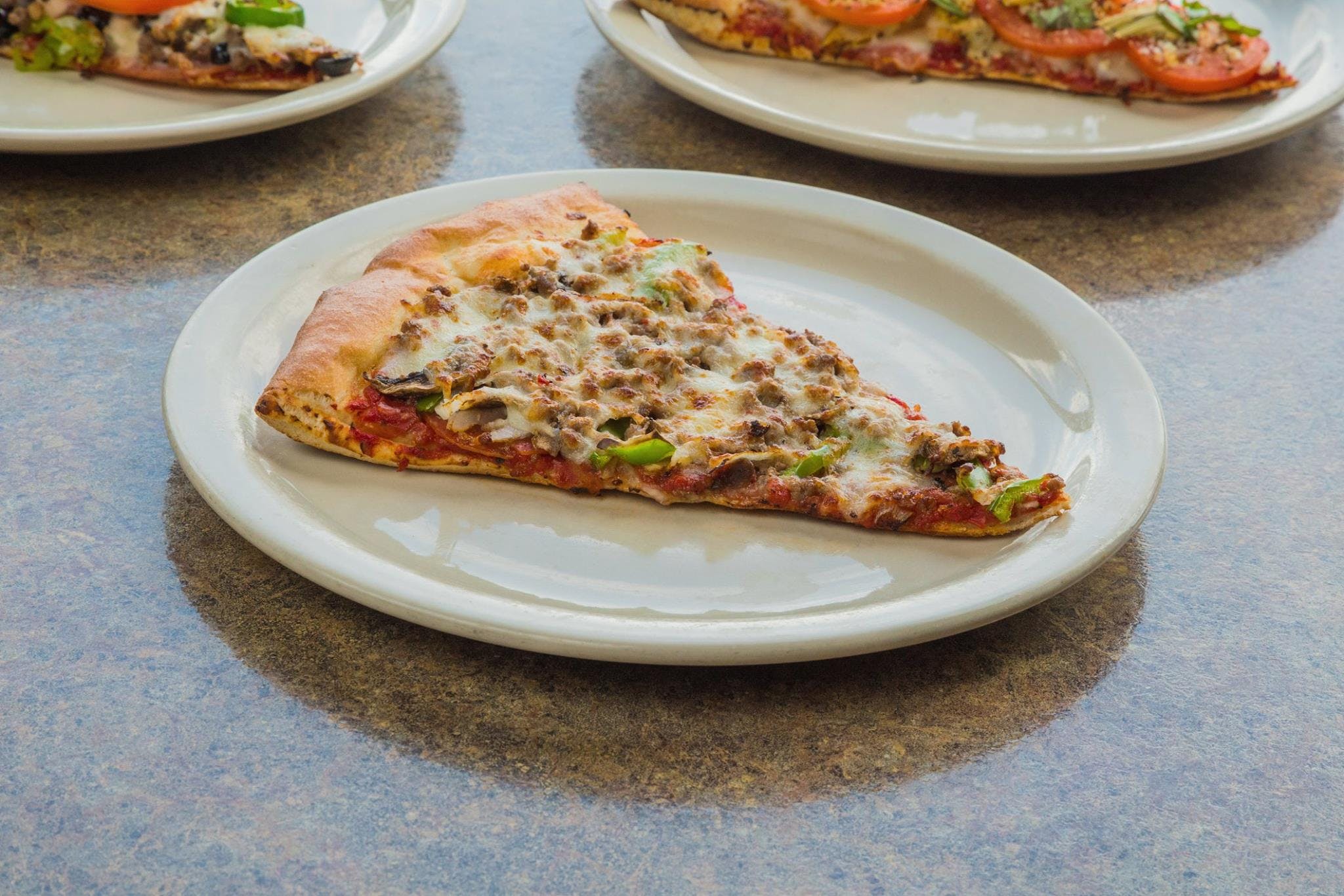 Order New York Deluxe Pizza Slice - Slice food online from Zio Pizzeria - store, Omaha on bringmethat.com