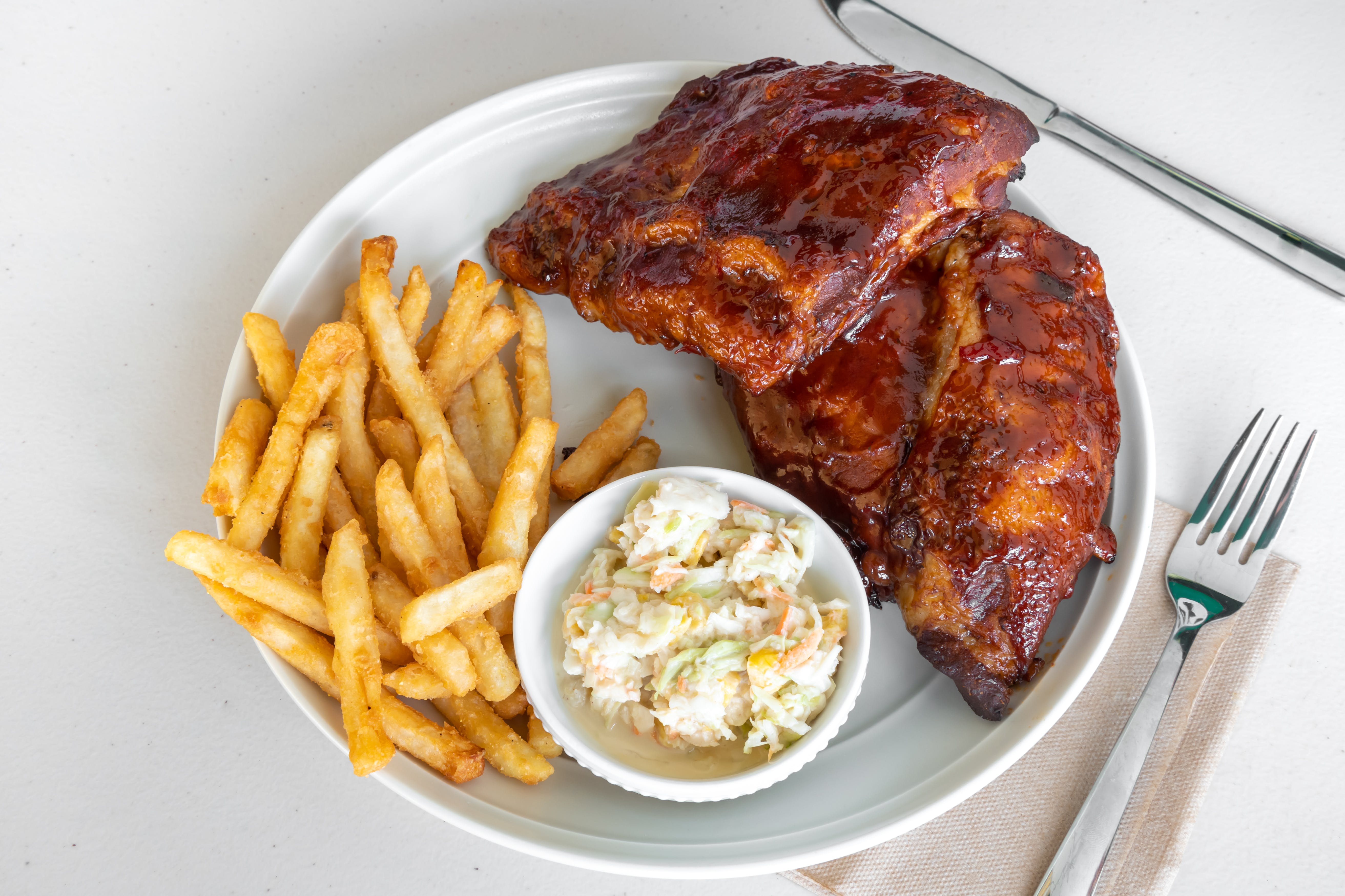 Order Our Signature Baby Back Ribs - Half Rack food online from Pizza Machine - Hollywood store, Hollywood on bringmethat.com