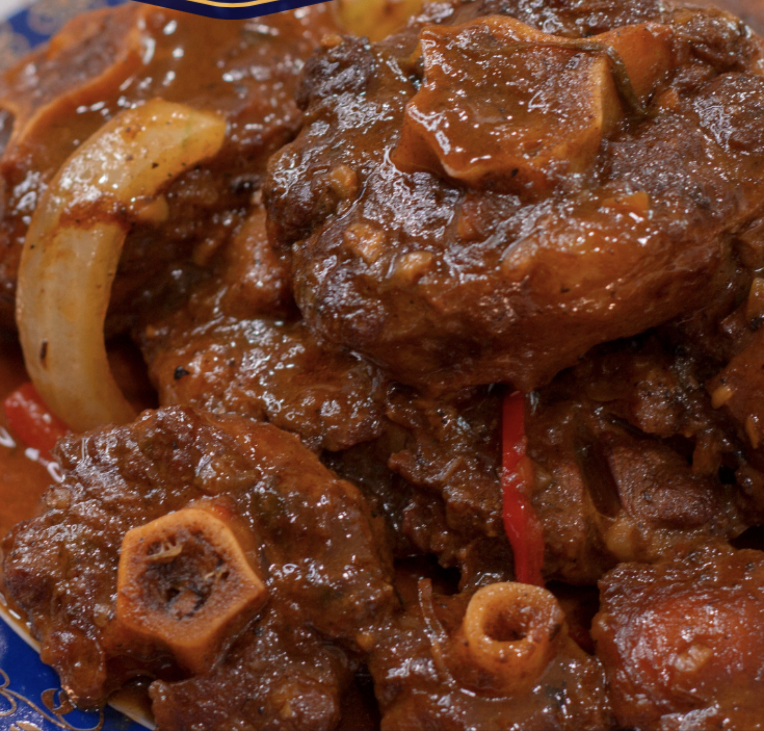 Order STEW OXTAIL PLATTER food online from Paradise Jamaican Cuisine store, Morrisville on bringmethat.com