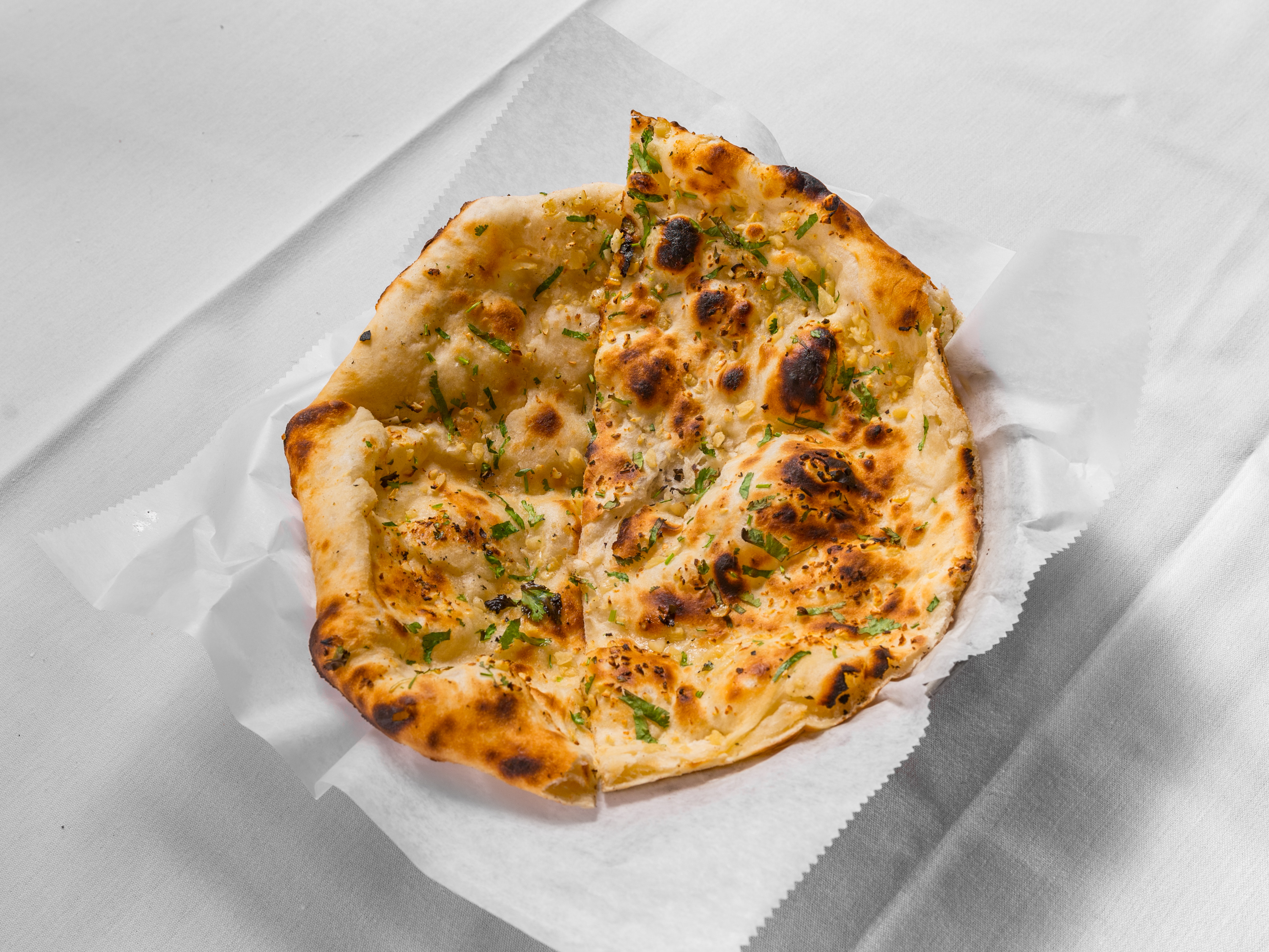 Order Garlic Naan food online from Moghul store, Vestal on bringmethat.com