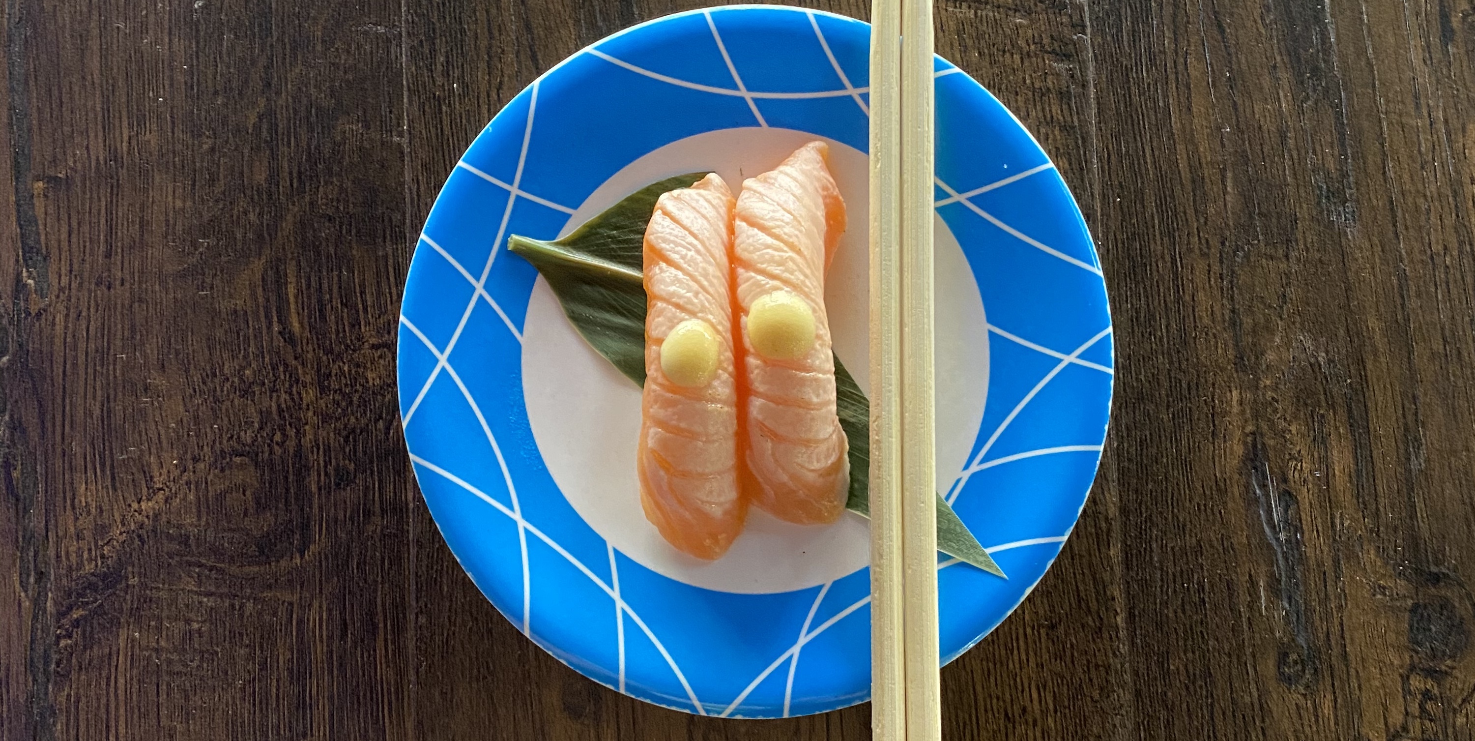 Order Seared Salmon Nigiri - 2 Pieces food online from Sushi Train store, Minneapolis on bringmethat.com