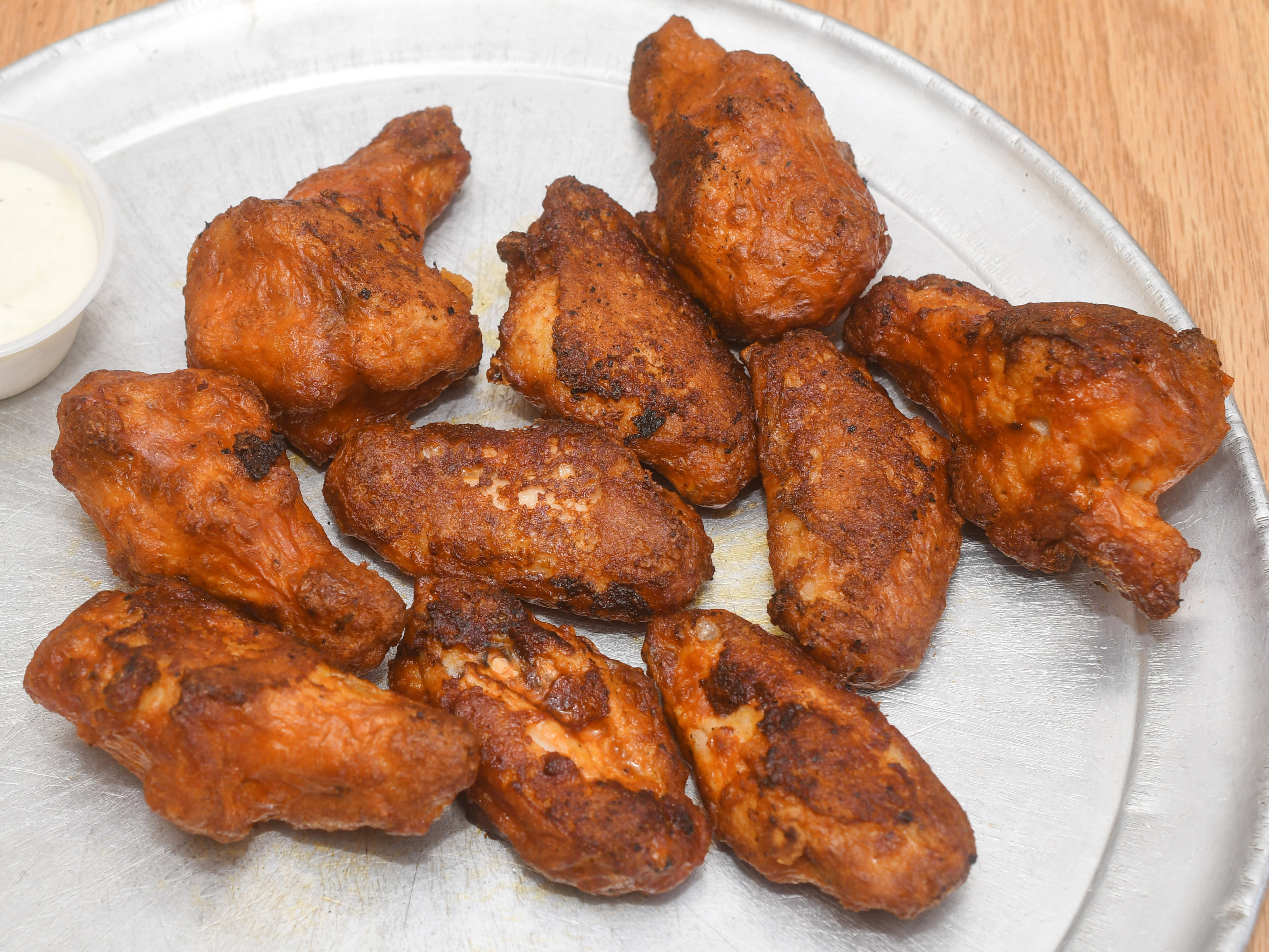 Order 10 Hot and Spicy Buffalo Wings food online from Pizza Hut store, Modesto on bringmethat.com