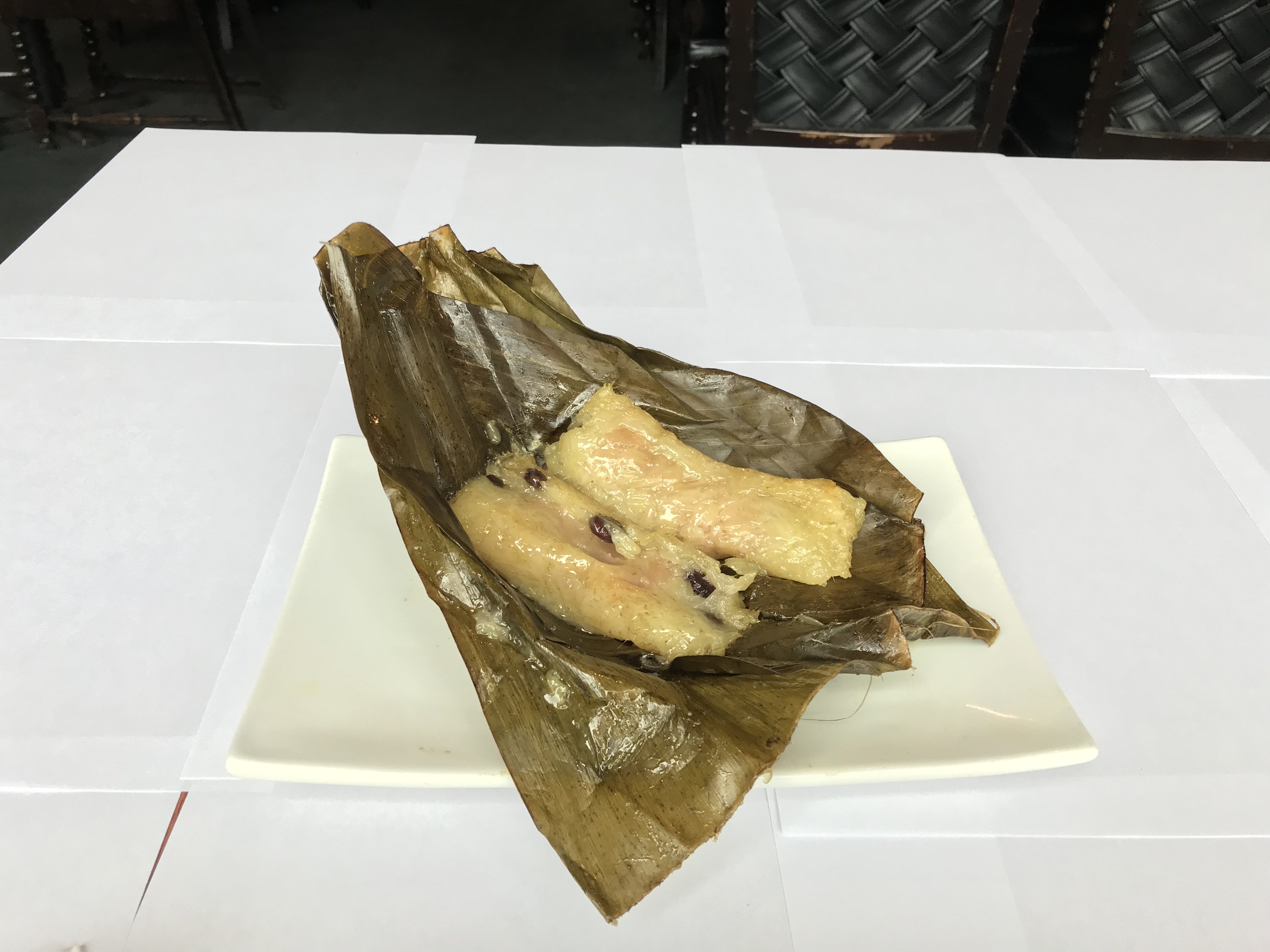 Order Sticky Rice in Banana Leaf food online from Pho's Thai Cuisine store, Chicago on bringmethat.com
