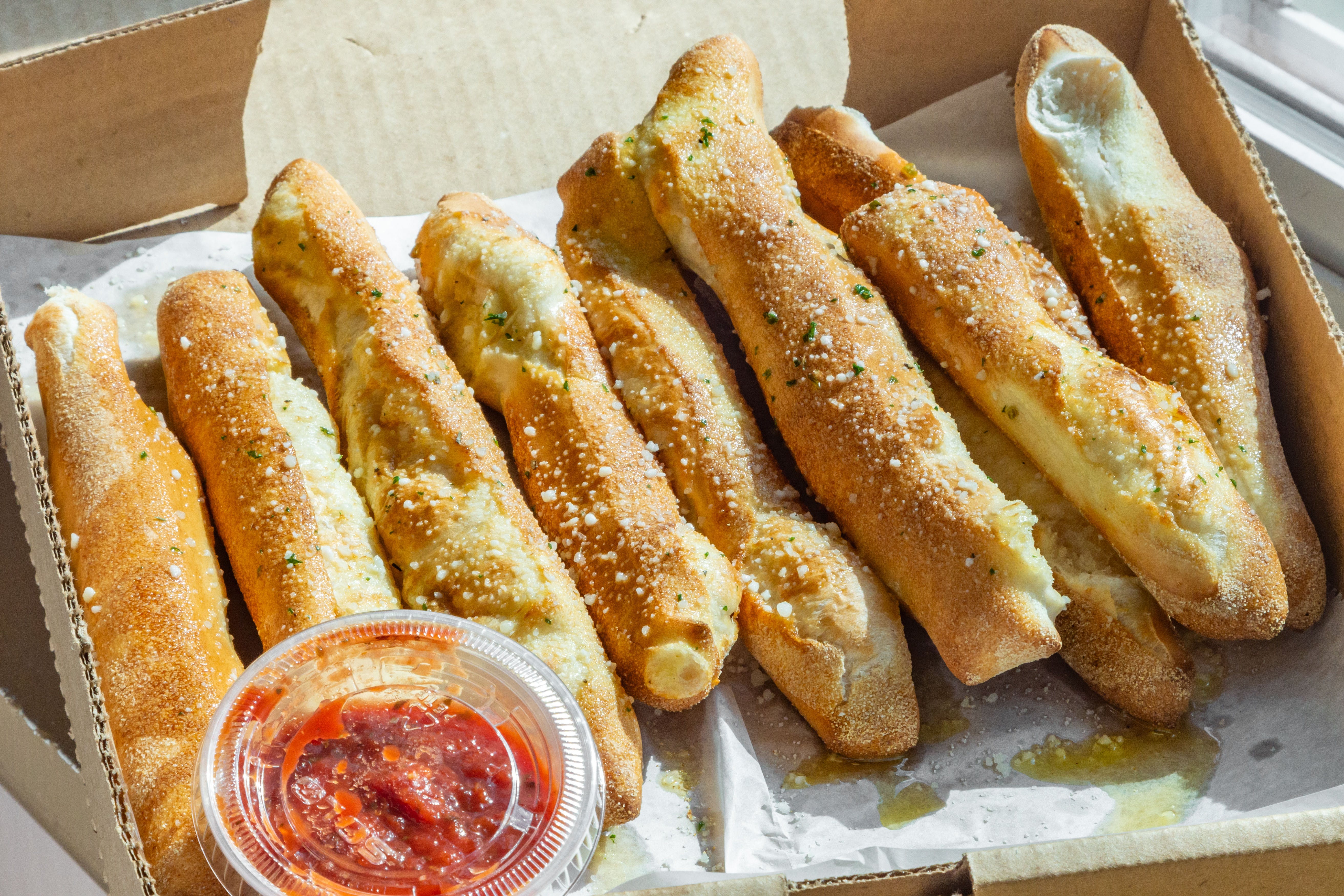 Order Breadsticks - 8 Pieces food online from Pizza On Main store, Washington on bringmethat.com