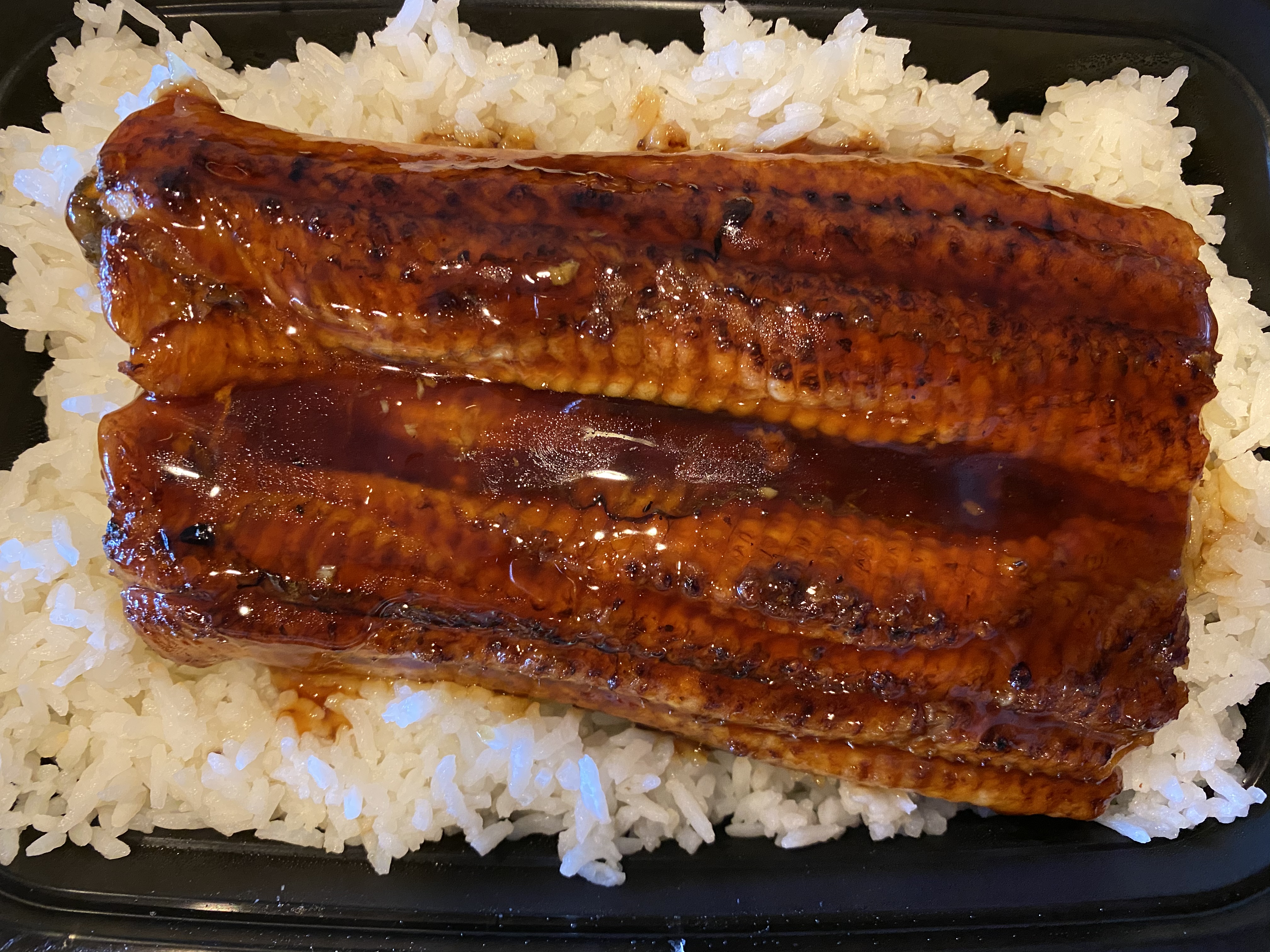 Order Monster EEL  over rice  food online from Cajun Seafood House store, Los Angeles on bringmethat.com