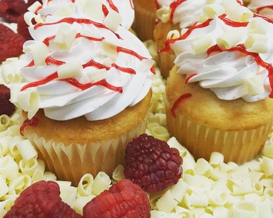 Order White Chocolate Raspberry Cupcakes (pack of 2) food online from The Pennsylvania Bakery store, Camp Hill on bringmethat.com