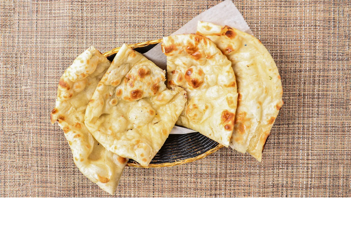 Order Plain Naan food online from Indian Cuisine store, Portage on bringmethat.com