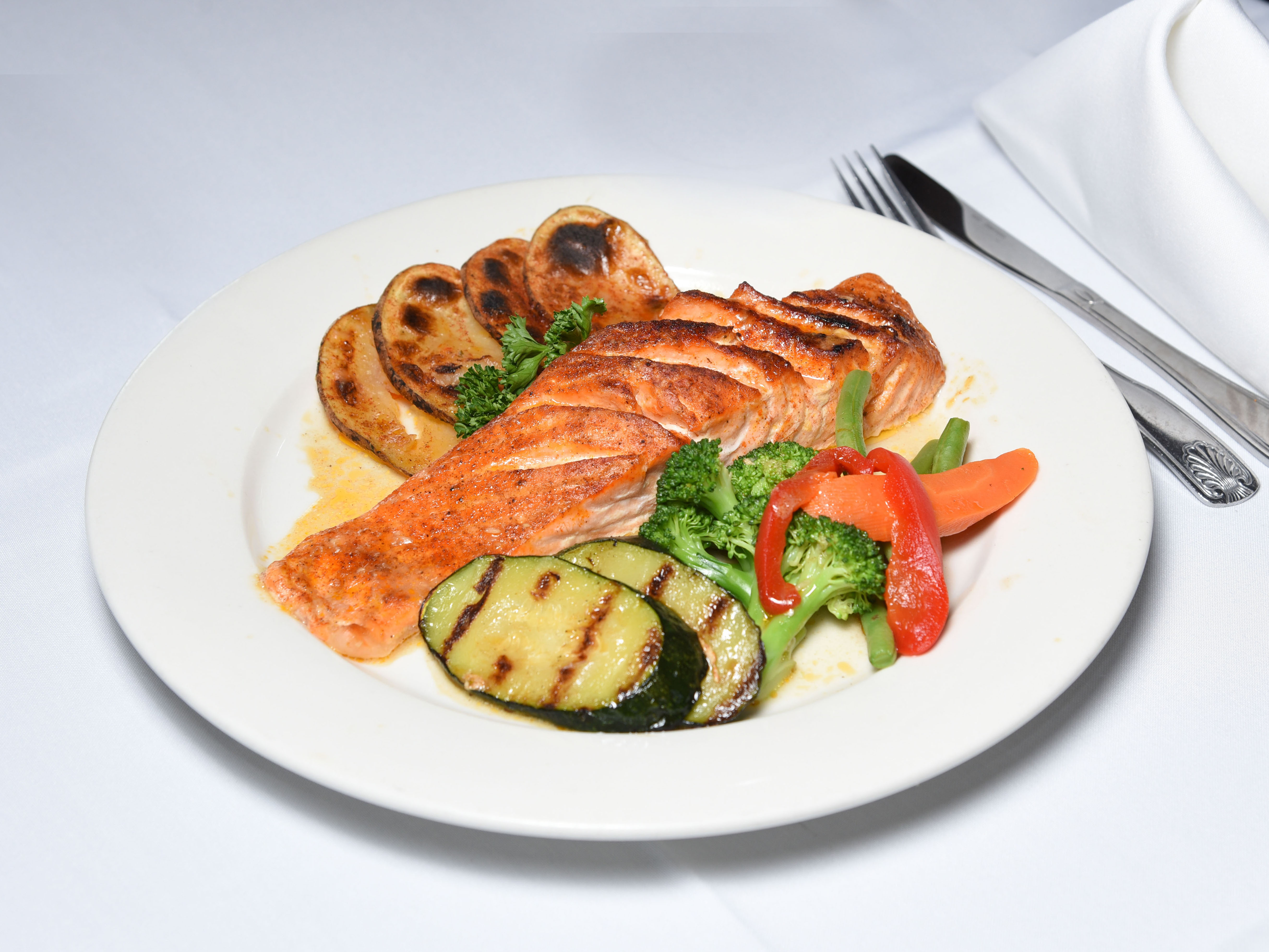 Order Grilled Salmon with Vegetables* food online from Caridad and Louie Restaurant Corp store, Bronx on bringmethat.com