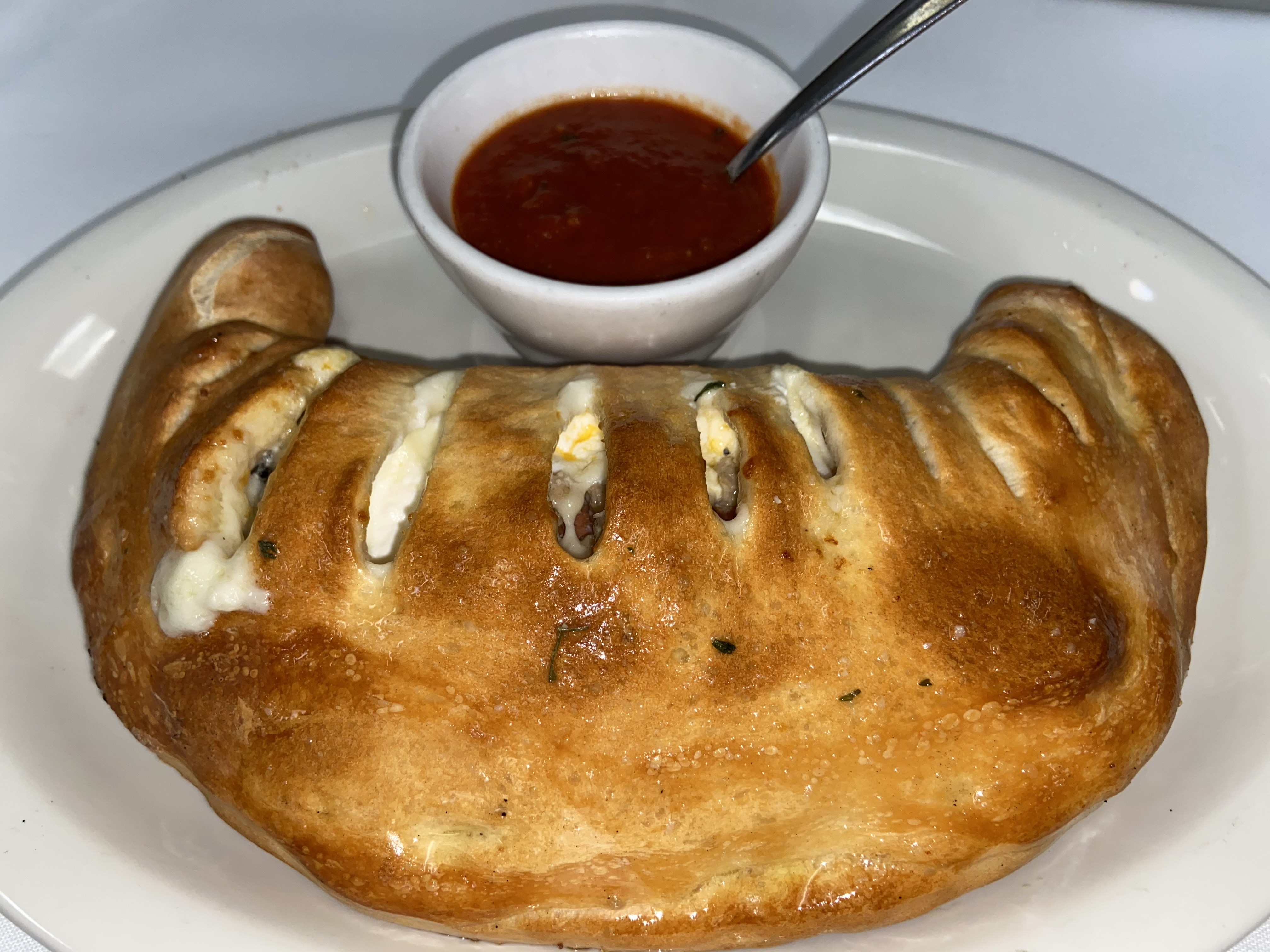 Order Calzone food online from Vitto's Pizza & Grill store, Garland on bringmethat.com