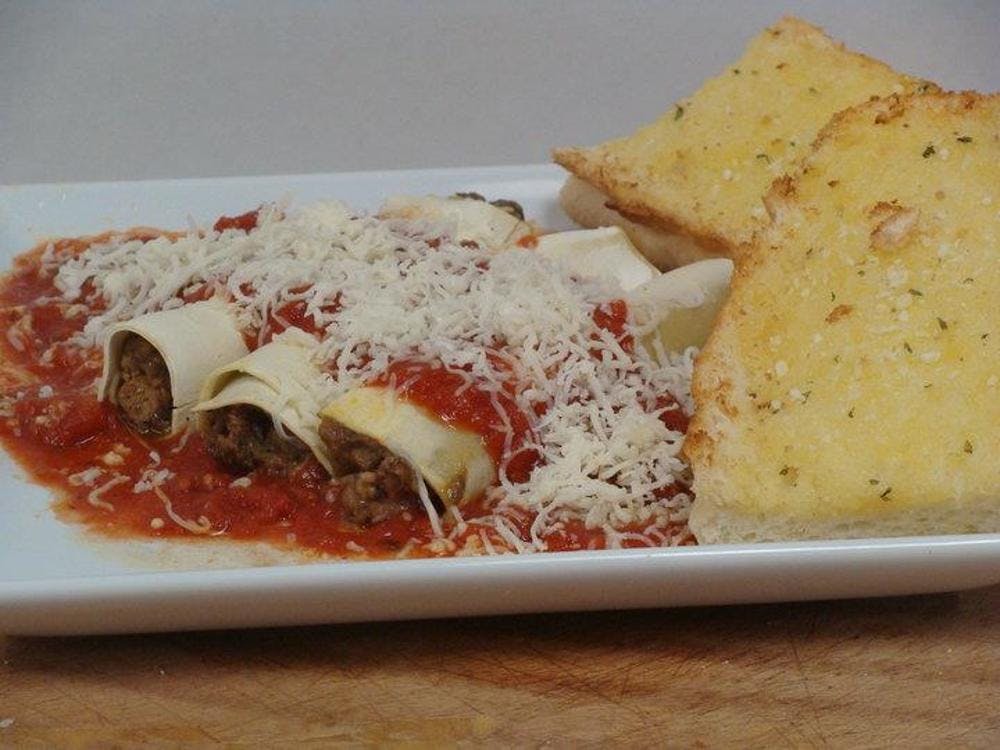 Order Manicotti - Pasta food online from Marcello's Pizza and Pasta store, Riverside on bringmethat.com